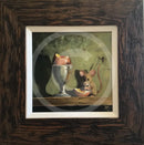 Egg in a Cup by Anthony Marn — a bright-eyed mouse nibbling egg beside a silver-coloured egg cup on a wooden ledge, against an olive-green wall, in a rustic dark wood frame with a white inner slip