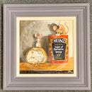 A framed painting depicting two small mice around a Heinz tomato soup can and a piece of bread, set within a white mat and a gray frame.