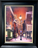Framed artwork of a York city street scene at night.