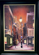 Framed artwork of a York city street scene at night with streetlights and buildings.