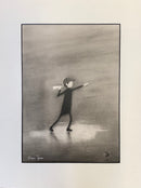 A monochrome art print featuring a stylized figure in a long dark coat and hat, holding a light source that casts a glow on the ground. The artwork is signed by artist Shaun Tymon in the lower-left corner and is presented on a white mat against a light gray background.