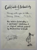 A Certificate of Authenticity card for Sam Toffoli's artwork 'Coming Home', dated 17/2/7. The card features a black ink signature and a black ink sketch of a figure on an off-white paper background.