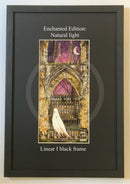 Framed artwork with a ghostly figure in front of a gothic archway.