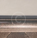 Small white mark on the bottom section of the frame