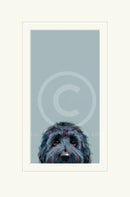 Framed artwork of a dog's face on a light blue background