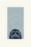 Framed artwork of a dog's face on a light blue background