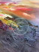 Close-up of a textured surface with multicolored paint strokes