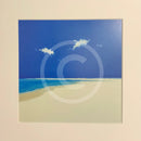 artwork of a blue sky with two clouds over a white sand beach.