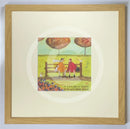 Meet the Mustards: A Good Bit of Gossip by Sam Toft, mounted miniature print. A couple sat on a bench having a gossip. Their black and white dog sits beside them while two white ducks look on. Framed in oak.