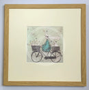 Meet the Mustards: All Aboard the Ducky Express by Sam Toft, mounted miniature print. A fun pictures of a man on a bicycle with two baskets carrying several white ducks and his black and white dog. Framed in oak.