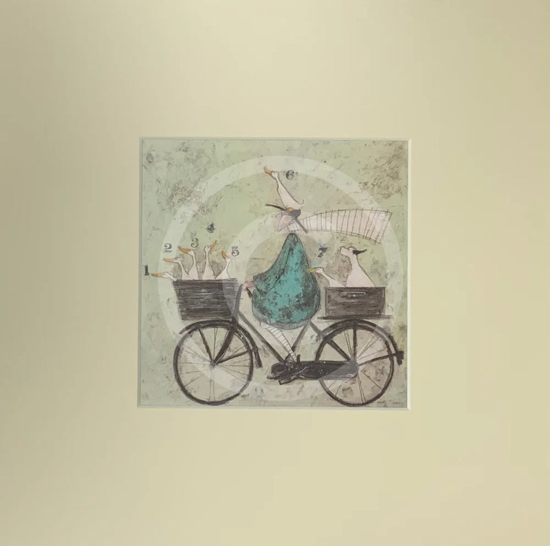 Meet the Mustards: All Aboard the Ducky Express by Sam Toft, mounted miniature print. A fun pictures of a man on a bicycle with two baskets carrying several white ducks and his black and white dog. 