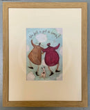 Meet the Mustards: The Best is Yet to Come by Sam Toft, mounted miniature print. A couple with linked arms skipping in the clouds with their black and white dog. Framed in oak.