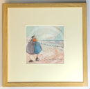 Meet the Mustards: Counting White Horses by Sam Toft, mounted miniature print. A couple on a beach with a black and white dog embracing, and looking up a the clouds. Framed in oak.