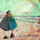 Meet the Mustards: Counting White Horses by Sam Toft, mounted miniature print. A couple on a beach with a black and white dog embracing, and looking up a the clouds. 