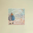 Meet the Mustards: Counting White Horses by Sam Toft, mounted miniature print. A couple on a beach with a black and white dog embracing, and looking up a the clouds. 