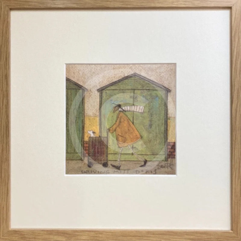 Meet the Mustards: Driving Miss Doris by Sam Toft, mounted miniature print. A fun picture of a man taking his dog Dorris for a walk in her doggy pram past a row of green beach huts. Framed in oak.