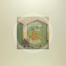 Meet the Mustards: Driving Miss Doris by Sam Toft, mounted miniature print. A fun picture of a man taking his dog Dorris for a walk in her doggy pram past a row of green beach huts. 