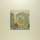 Meet the Mustards: Driving Miss Doris by Sam Toft, mounted miniature print. A fun picture of a man taking his dog Dorris for a walk in her doggy pram past a row of green beach huts. 