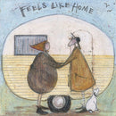 Meet the Mustards: Feels Like Home by Sam Toft, mounted miniature print. A nostalgic picture of an elderly couple holding hands outside their vintage caravan with a little black and white dog.