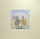 Meet the Mustards: Feels Like Home by Sam Toft, mounted miniature print. A nostalgic picture of an elderly couple holding hands outside their vintage caravan with a little black and white dog.