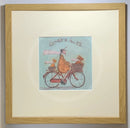 Meet the Mustards: Ginger Nuts by Sam Toft, mounted miniature print. A fun print of a man riding his bicycle with a ginger coloured dog riding in the basket at the front and a striped ginger cat riding on the back. Framed in oak.