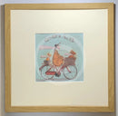 Meet the Mustards: Ginger Nuts by Sam Toft, mounted miniature print. A fun print of a man riding his bicycle with a ginger coloured dog riding in the basket at the front and a striped ginger cat riding on the back. Framed in oak.