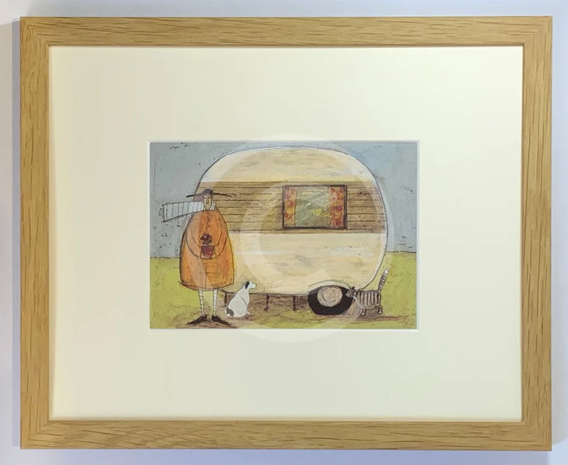 Meet the Mustards: Home from Home by Sam Toft, mounted miniature. A man and a black and white dog stand outside an old style caravan. Framed in oak.