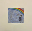 Never Forgotten by Sam Toft Mounted print with Mr Mustard, Doris the dog looking up to a rainbow through a blue sky.