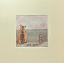 Meet the Mustards: Sea Cat by Sam Toft, mounted miniature print. A ginger cat sitting looking out to sea next to a miniature light house. 