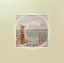 Meet the Mustards: Sea Cat by Sam Toft, mounted miniature print. A ginger cat sitting looking out to sea next to a miniature light house. 