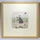Meet the Mustards: Yay! by Sam Toft, mounted miniature print. A fun picture of a man, Mr Mustard holding a red balloon, rebelliously riding his scooter along the promenade, with his black and white dog Doris on board.  Framed in oak.