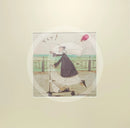 Meet the Mustards: Yay! by Sam Toft, mounted miniature print. A fun picture of a man, Mr Mustard holding a red balloon, rebelliously riding his scooter along the promenade, with his black and white dog Doris on board.  