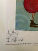 A close-up of a printed artwork or art print showing a partial colorful illustration with a large red circular form, blue-green background, and a small black line drawing with a signature. Text at the bottom reads 'More than Words Can Say' by Sam Toft.