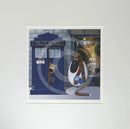 Mounted Miniature Print Doctor Ewe, by Simon Clarke . A fun illustration of a sheep character  dressed as Tom Baker from Doctor Who, with a blue police box a dog peeking outside and travel agent shop in the background.
