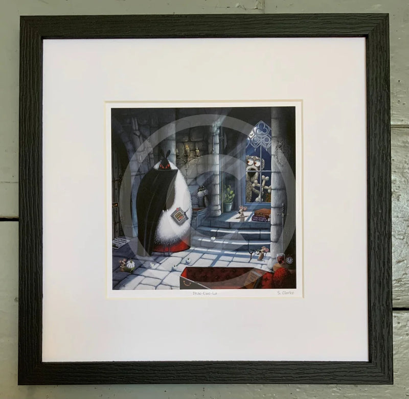 Mounted  Miniature Print, Drac-Ewe-La, by Simon Clarke. A fun picture of a sheep playing Count Dracula in his castle. A dog is outside the window with two bones made into a cross. Framed in linear I black.
