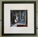 Mounted  Miniature Print, Drac-Ewe-La, by Simon Clarke. A fun picture of a sheep playing Count Dracula in his castle. A dog is outside the window with two bones made into a cross. Framed in linear I black.