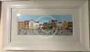 Framed artwork of a colourful York street scene with buildings and people.