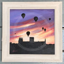 Framed artwork of hot air balloons against a sunset sky with a silhouette of York Minster
