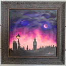 Framed artwork of London city skyline with a purple and pink sky.