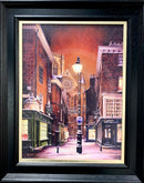 Framed artwork of a York city street scene at night.