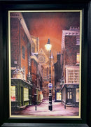 Framed artwork of a York city street scene at night with streetlights and buildings.