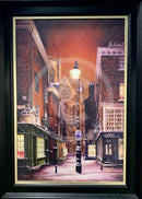 Framed artwork of a York city street scene at night with streetlights and buildings.