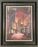 Framed painting of a The Shambles - a narrow York street with buildings at night.