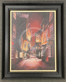 Framed painting of a The Shambles - a narrow York street with buildings at night.