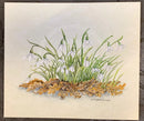 Snowdrops I by Natalja Olejnicka — miniature mixed media botanical painting of a sweeping drift of snowdrops with white bell-shaped blooms on slender green stems, rising from golden autumn leaf litter on pale green marbled mountcard