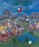 Colorful village scene with hot air balloons and mountains in the background