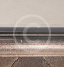 Small white mark on the bottom section of the frame