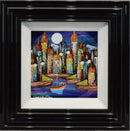 Framed artwork of a colorful cityscape with a boat on water