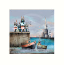 Fishing boats at a dock with houses and a lighthouse in the background