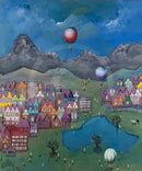 Colorful village scene with hot air balloons and mountains in the background